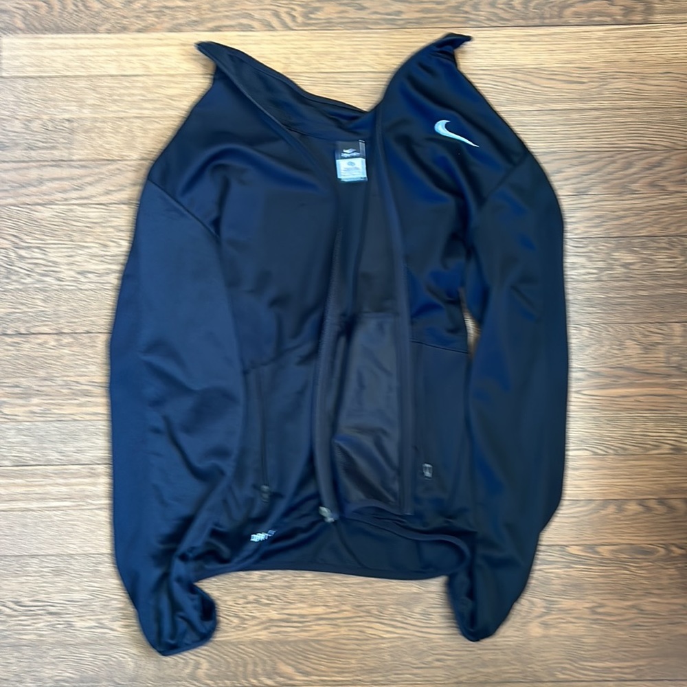 Light weight runners jacket. All black almost shiny.